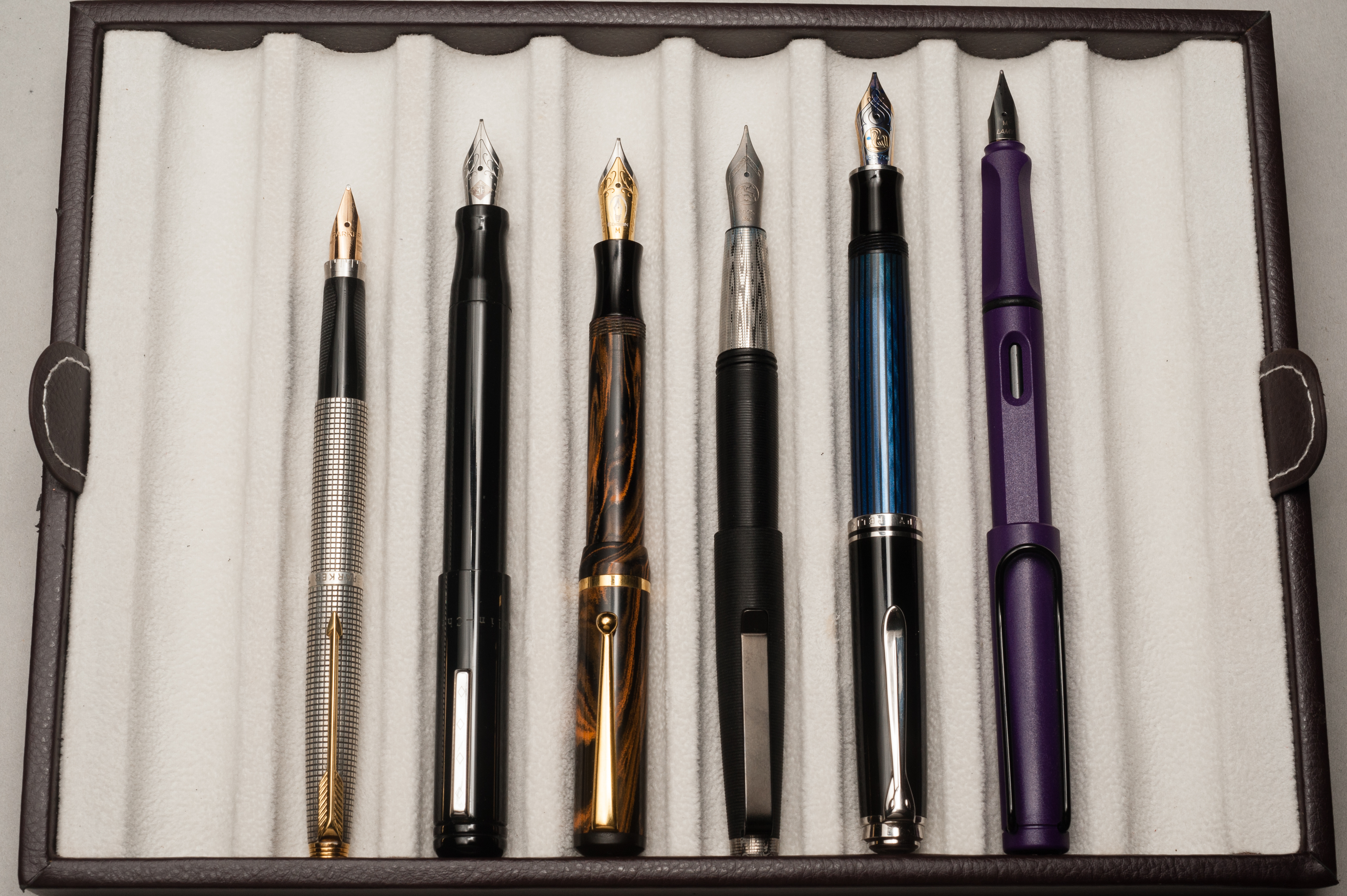 Posted pens from left to right: Parker 75, Franklin-Christoph Model 20, Edison Beaumont, Tactile Turn Gist, Pelikan M805, and Lamy Safari