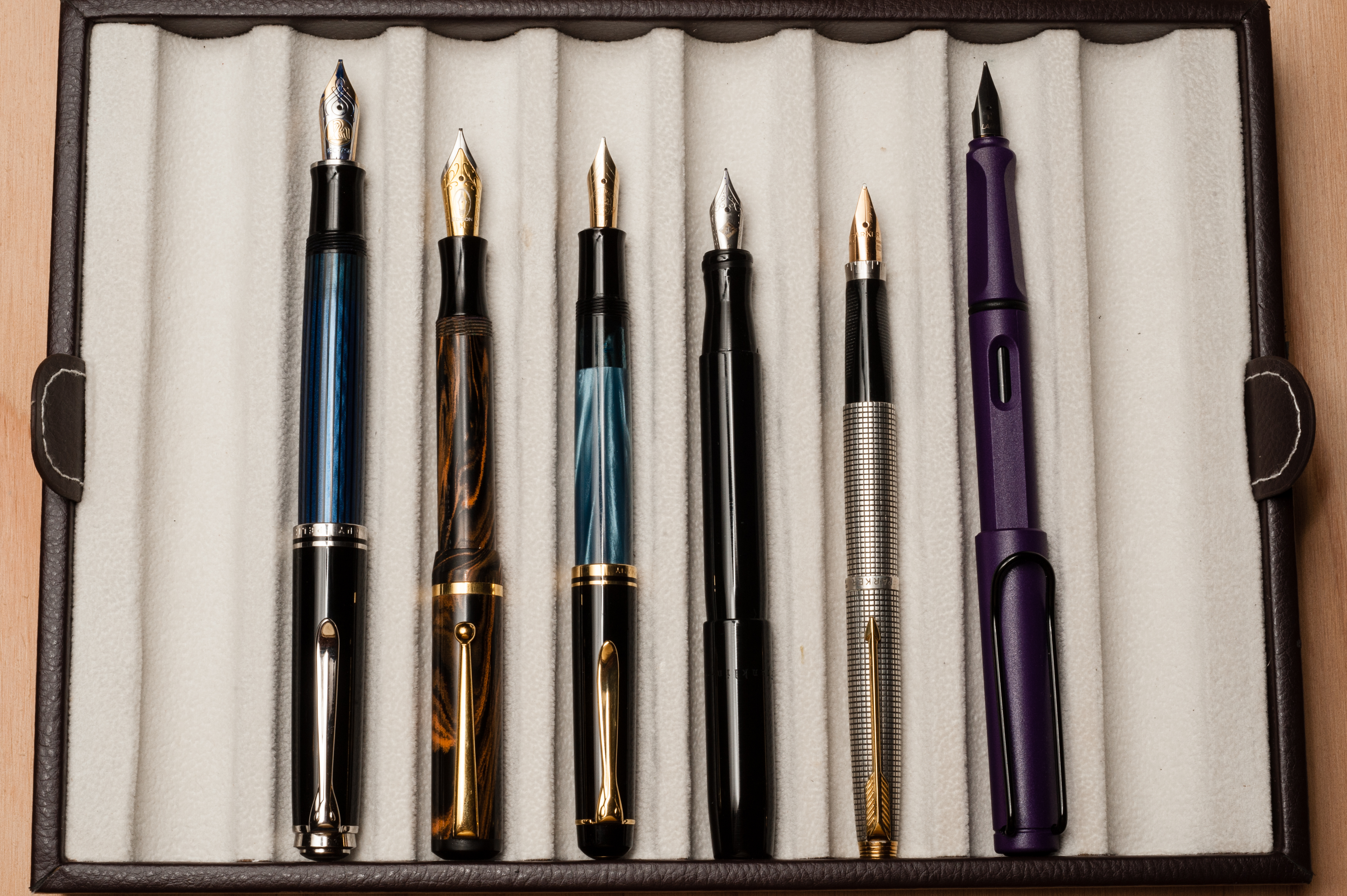 Posted cap from left to right: Pelikan M805, Edison Beaumont, Pelikan M200, Franklin-Christoph Model 45, Parker 75, and Lamy Safari