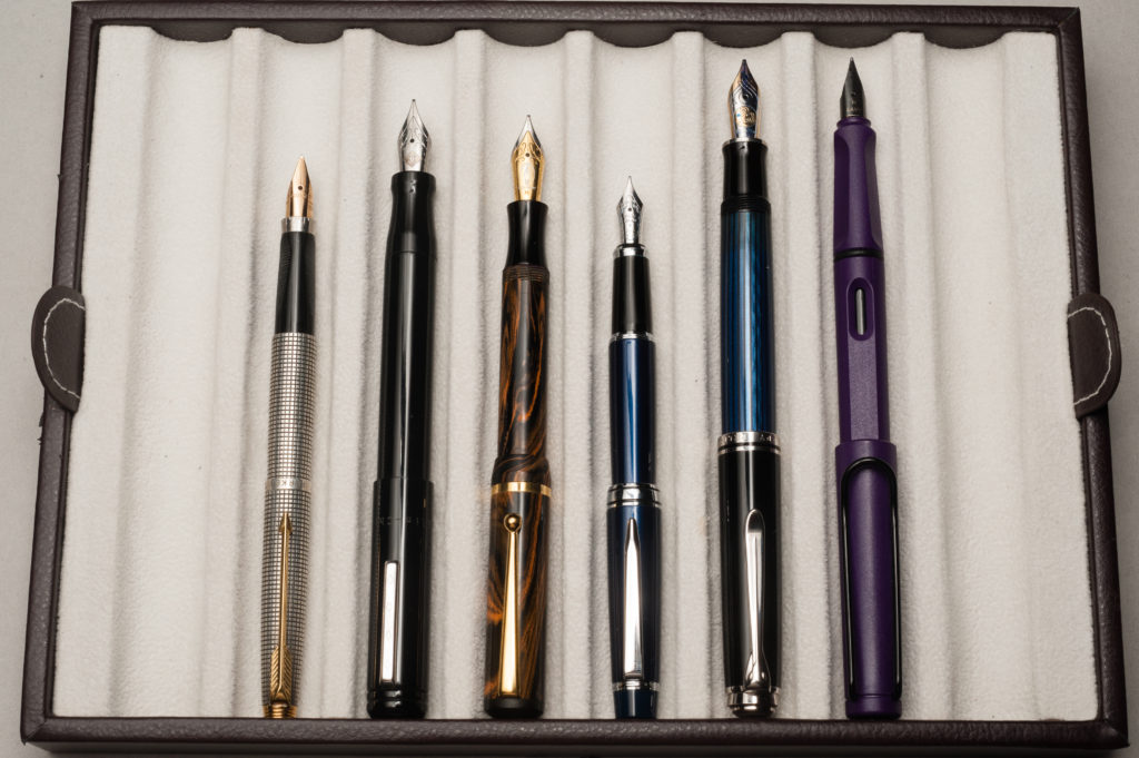 Posted pens from left to right: Parker 75, Franklin-Christoph Model 20, Edison Beaumont, Pilot Stargazer, Pelikan M805, and Lamy Safari